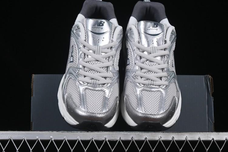 NB 530 "Grey Matter Silver Metallic"